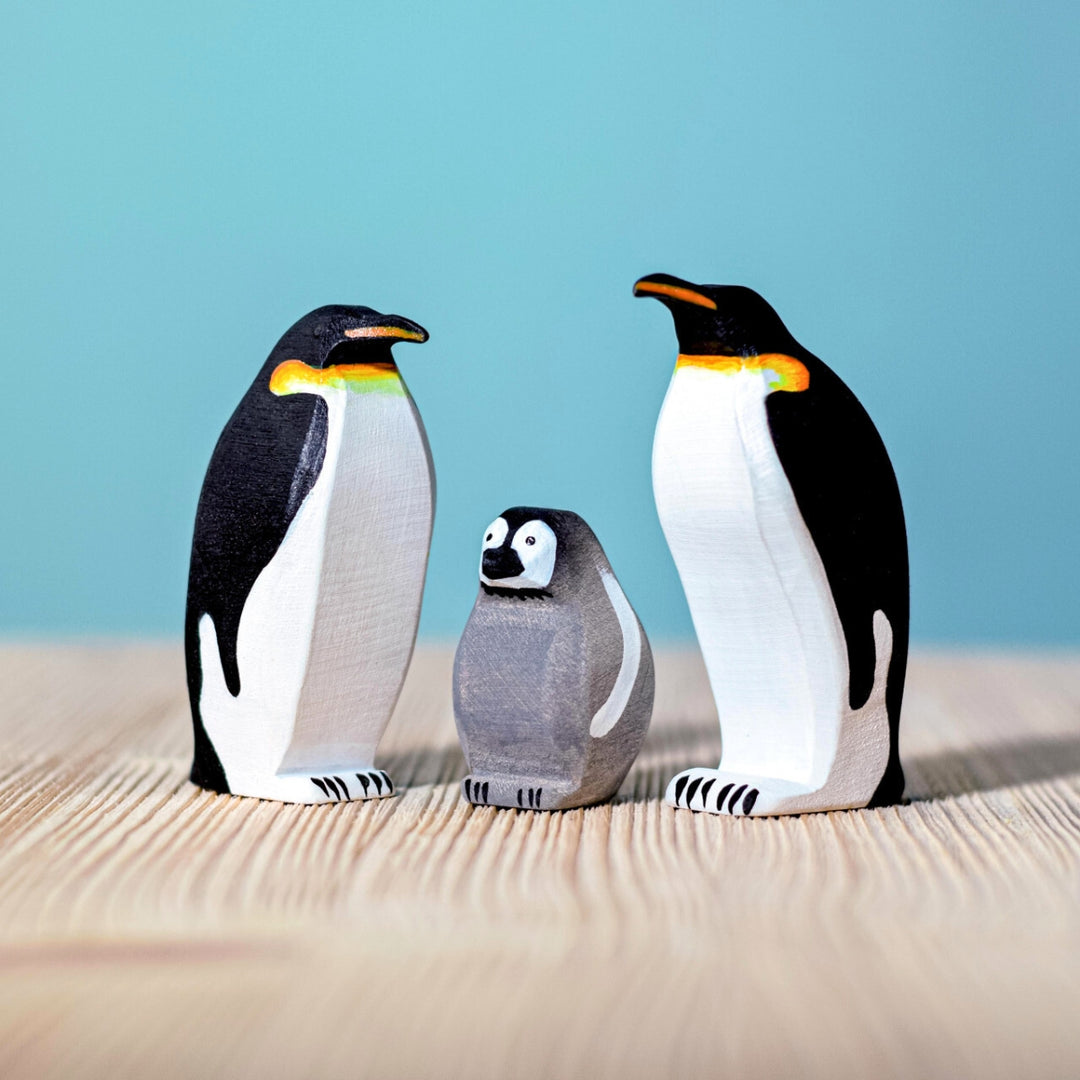 BumbuToys Handcrafted Wooden Bird Emperor Penguin Family Set from Australia in a small-world play setting
