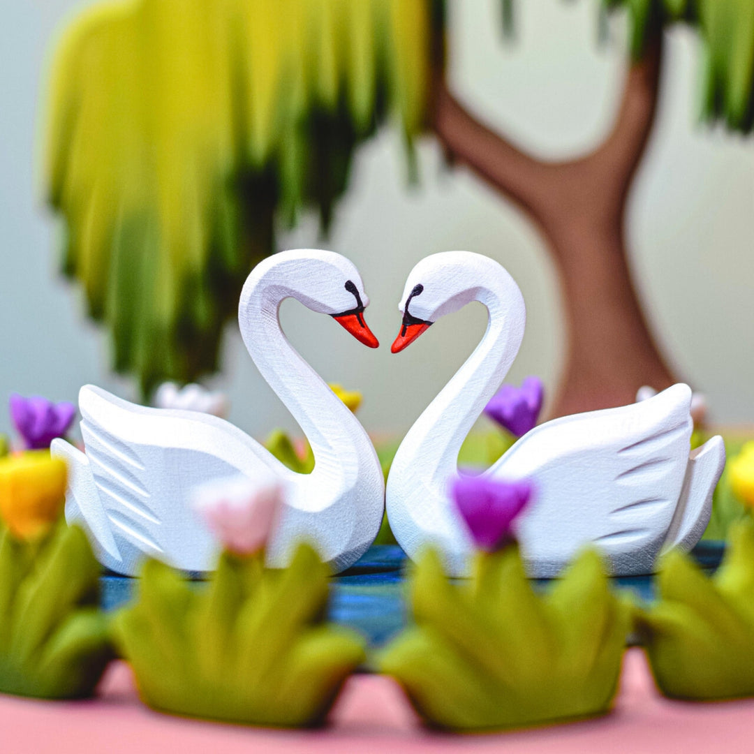 BumbuToys Handcrafted Wooden Swans and Heart Lake Set from Australia in a small-world play setting
