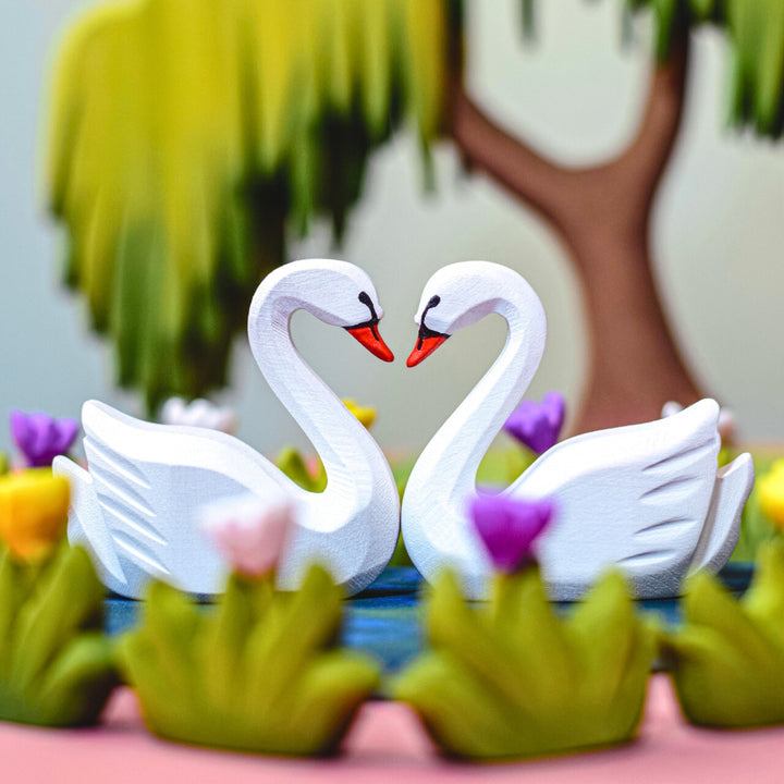 BumbuToys Handcrafted Wooden Swans and Heart Lake Set from Australia in a small-world play setting