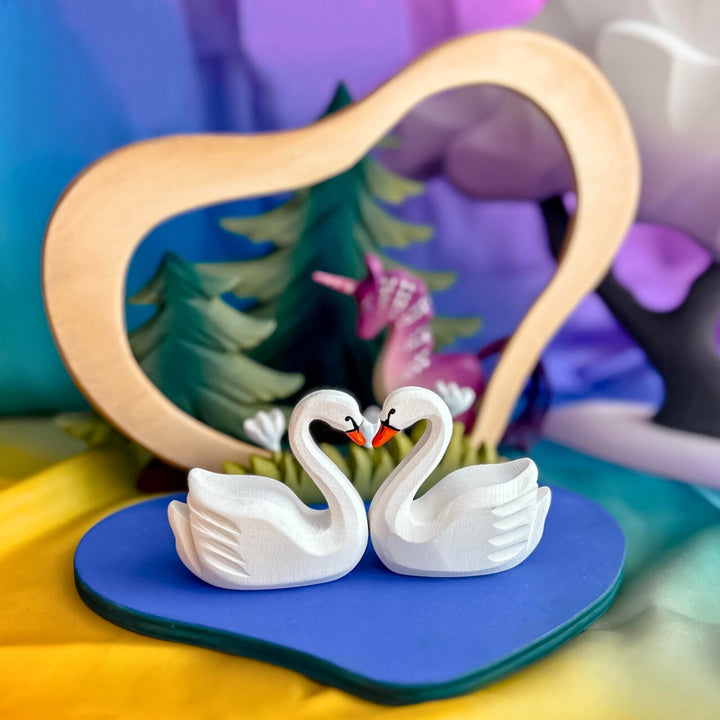 BumbuToys Handcrafted Wooden Swans and Heart Lake Set from Australia in a small-world play setting
