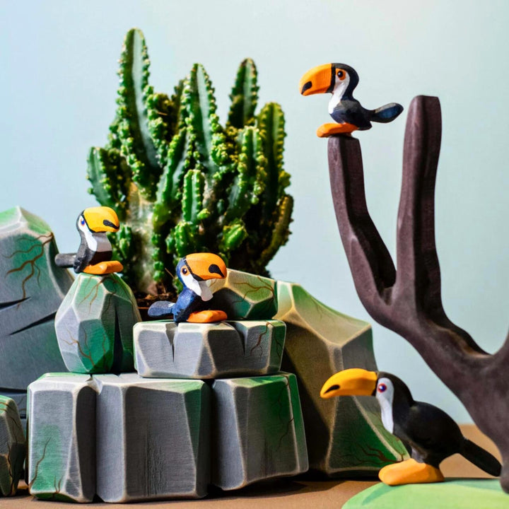 BumbuToys Handcrafted Wooden Bird Baby Toucan from Australia in a small-world play setting