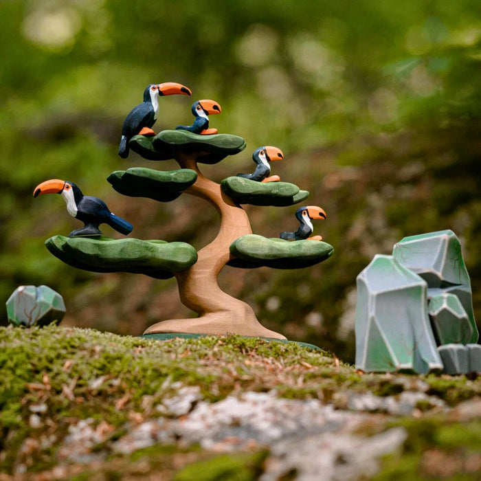 BumbuToys Handcrafted Wooden Bird Toucan Family Set from Australia in a small-world play setting