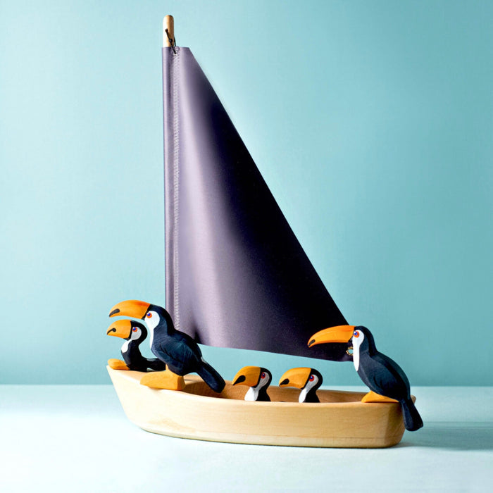 BumbuToys Handcrafted Wooden Bird Toucan Family Set from Australia in a small-world play setting