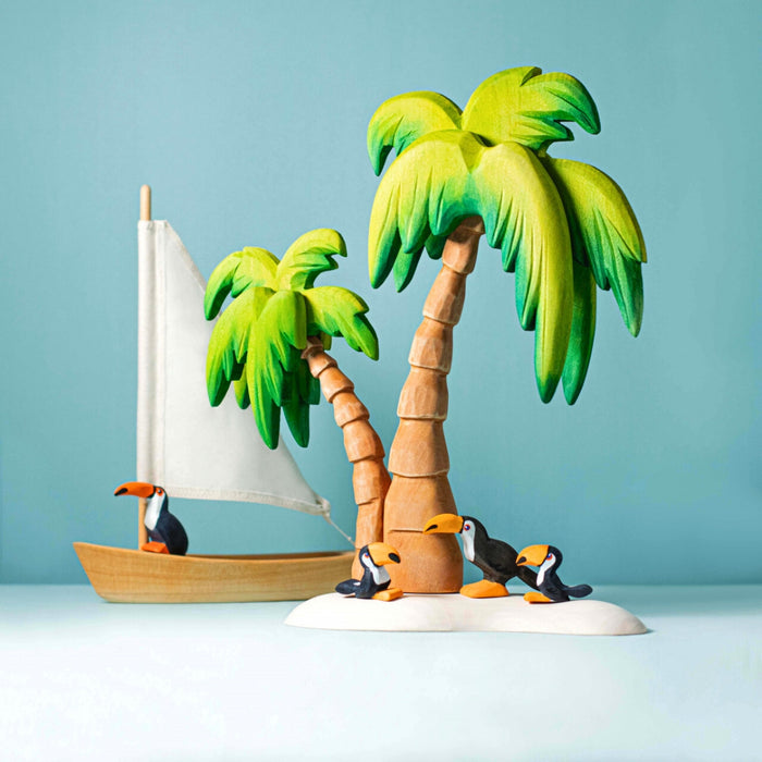 BumbuToys Handcrafted Wooden Bird Toucan Family Set from Australia in a small-world play setting