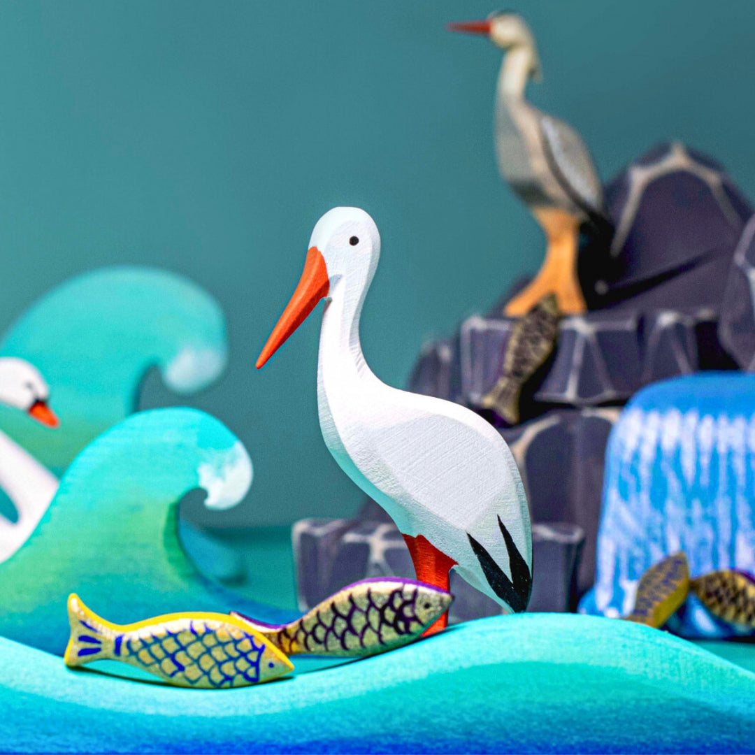 BumbuToys Handcrafted Wooden Bird White Stork from Australia in a small-world play setting