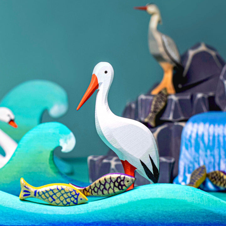 BumbuToys Handcrafted Wooden Bird White Stork from Australia in a small-world play setting