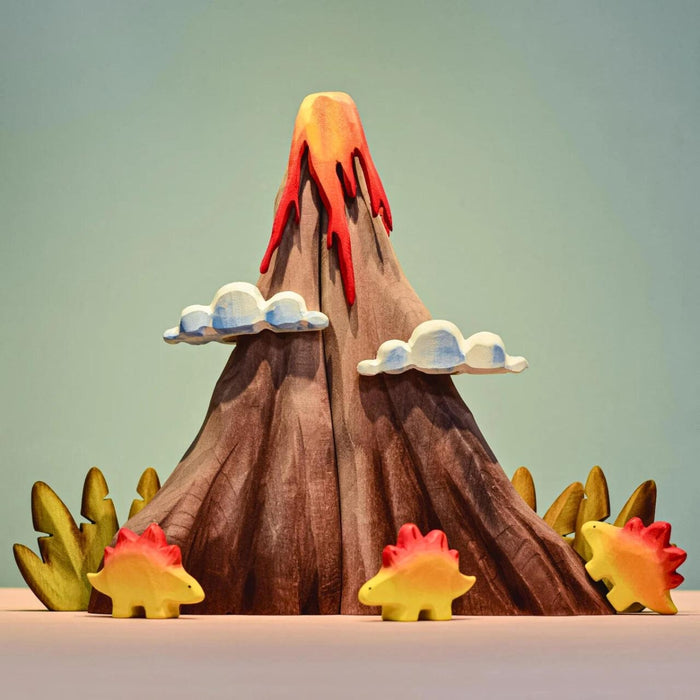 BumbuToys Handcrafted Wooden Dinosaur Baby Stegosaurus from Australia in a small-world play setting