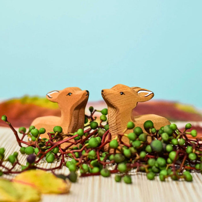 BumbuToys Handcrafted Wooden Farm Animal Deer Fawn Resting from Australia in a small-world play setting