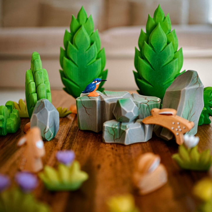 BumbuToys Handcrafted Wooden Landscape Mossy Rocks Set of 5 from Australia in a small-world play setting
