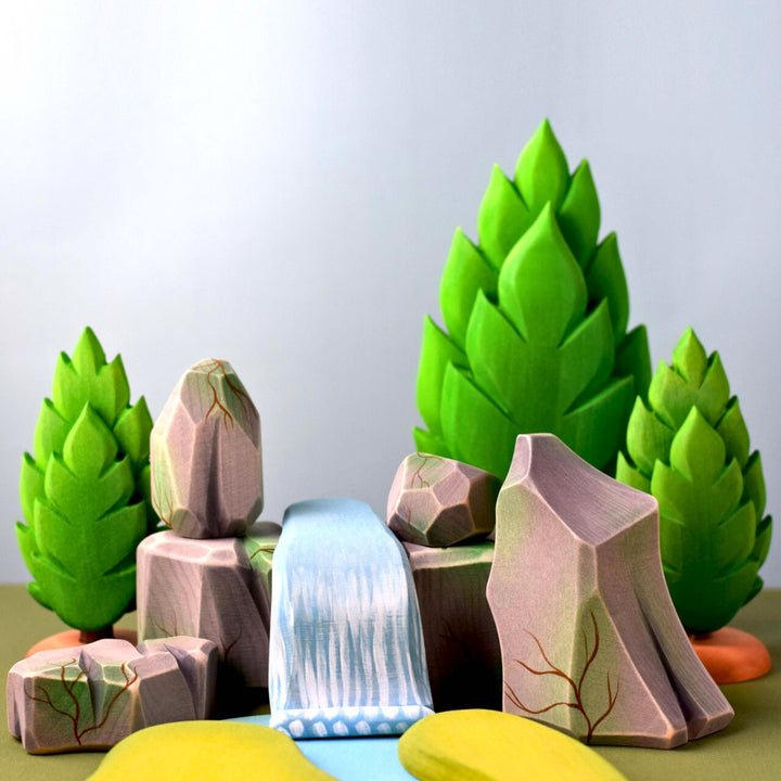 BumbuToys Handcrafted Wooden Landscape Mossy Rocks Set of 5 from Australia in a small-world play setting