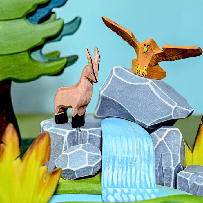 BumbuToys Handcrafted Wooden Landscape River Rocks from Australia in a small-world play setting