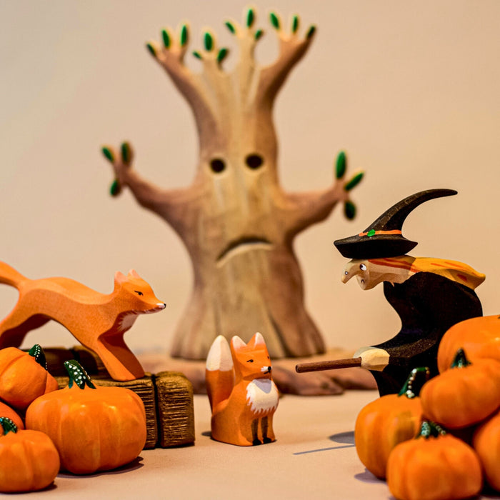 BumbuToys Handcrafted Wooden Witch Figure from Australia in a small-world play setting