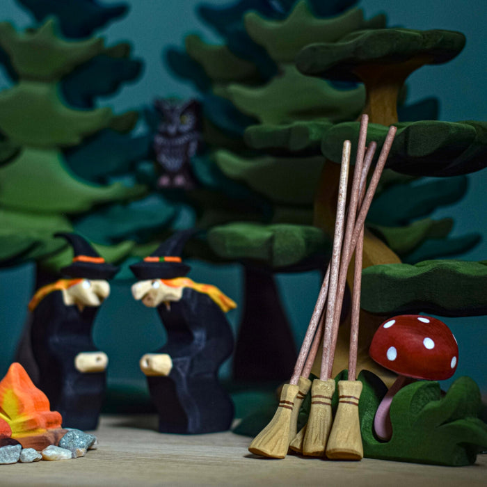BumbuToys Handcrafted Wooden Witch Figure from Australia in a small-world play setting