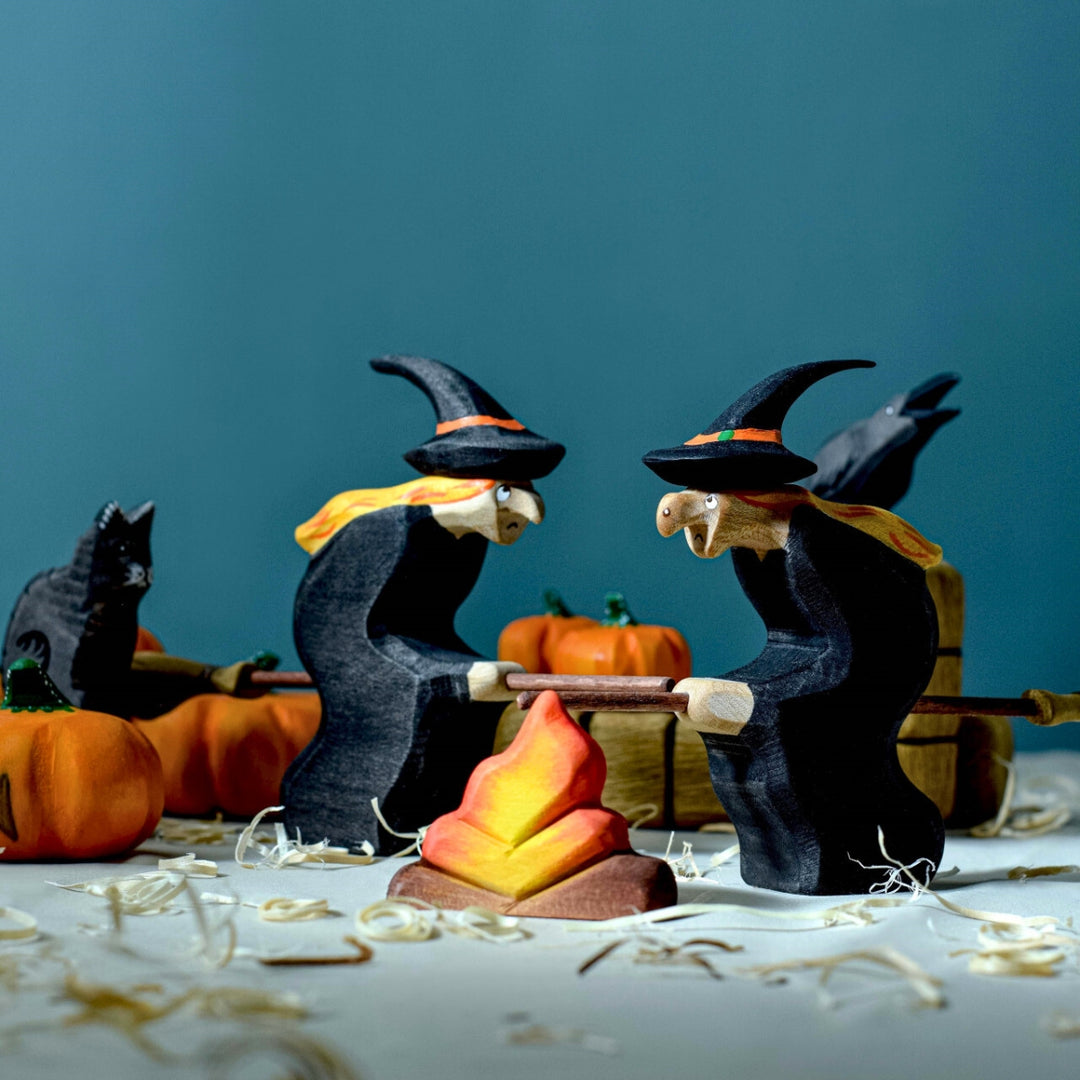 BumbuToys Handcrafted Wooden Witch Figure from Australia in a small-world play setting