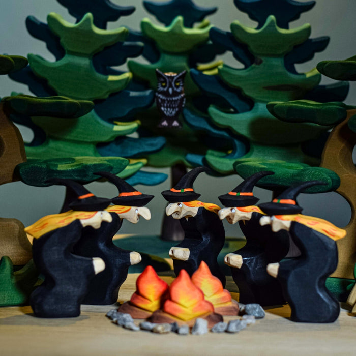 BumbuToys Handcrafted Wooden Witch Figure from Australia in a small-world play setting
