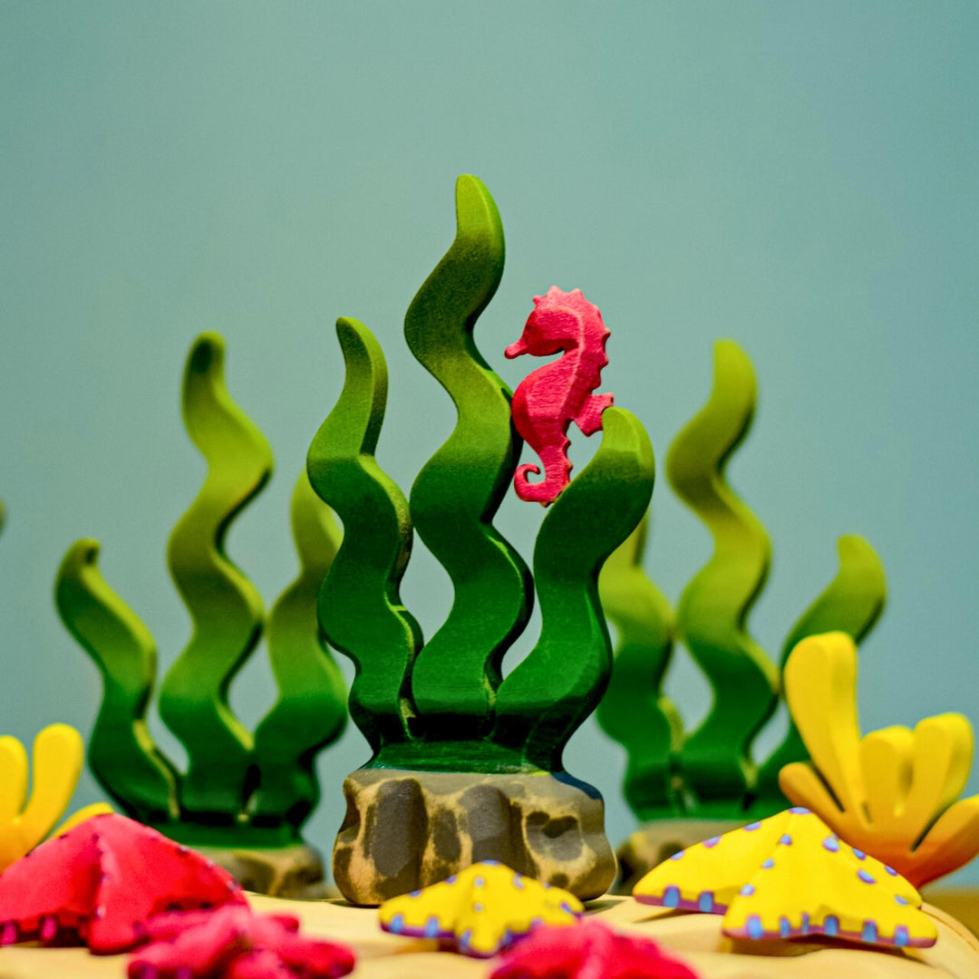 BumbuToys Handcrafted Wooden Seahorse from Australia in a small-world play setting