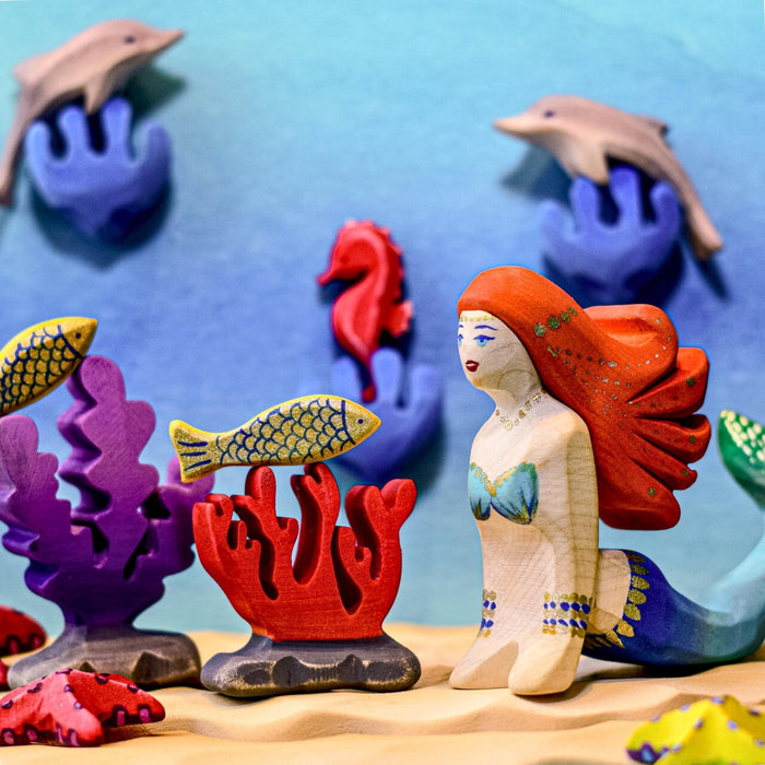 BumbuToys Handcrafted Wooden Figure Red Coral from Australia in an ocean small-world play setting