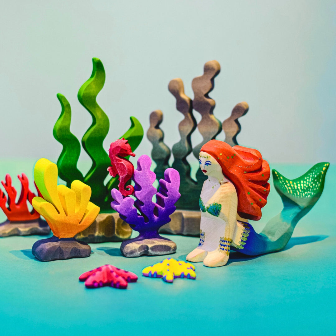 BumbuToys Handcrafted Wooden Sea Creature Figure Purple Seaweed from Australia in a small-world play setting