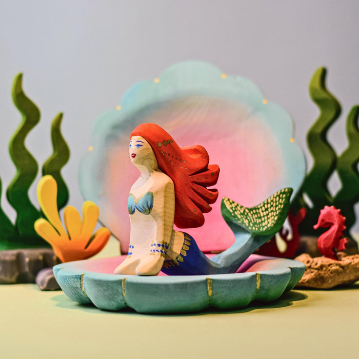 BumbuToys Handcrafted Large Shell Wooden Toy from Australia in a small-world play setting