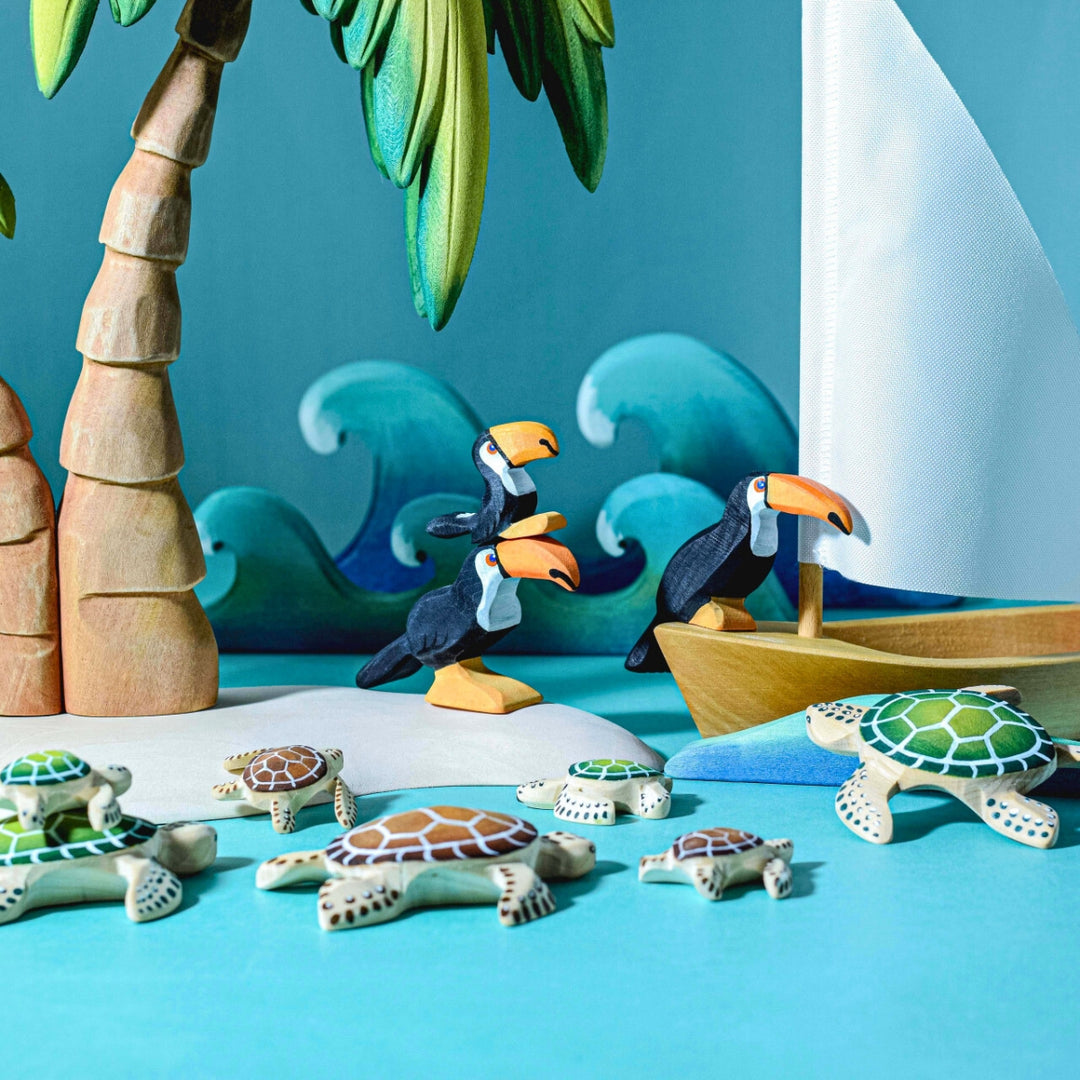 BumbuToys Handcrafted Wooden Turtle in Green from Australia in a small-world play setting