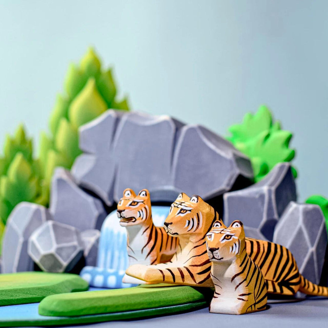 BumbuToys Handcrafted Wooden Animal Tiger Cub Sitting in a small-world play setting