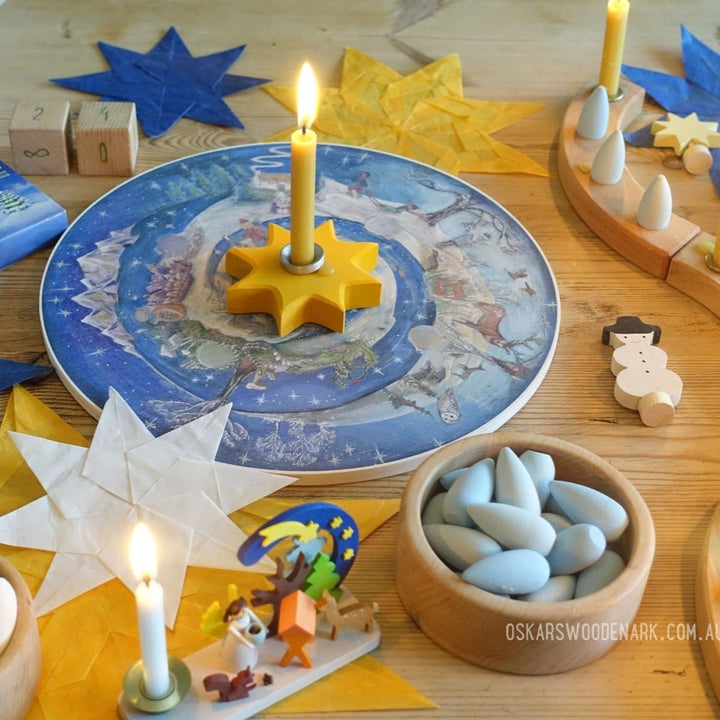 Waldorf Family Advent Wheel with Grimm's Celebration Ring Natural, Grimm's Candle Holders Brass and Aluminum, Grimm's Candles Amber, Grimm's Candle Holder Decorations Snowman and Angel, Graupner Small Candles White, Graupner Candle Holder Angel and The Nativity, Grapat Mandala Snowflakes and Mercurius Waxed Kite Paper