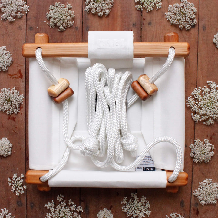 Merino White SOLVEJ Convertible Baby & Toddler Swing from Australia laid flat and compact for easy storage and portability