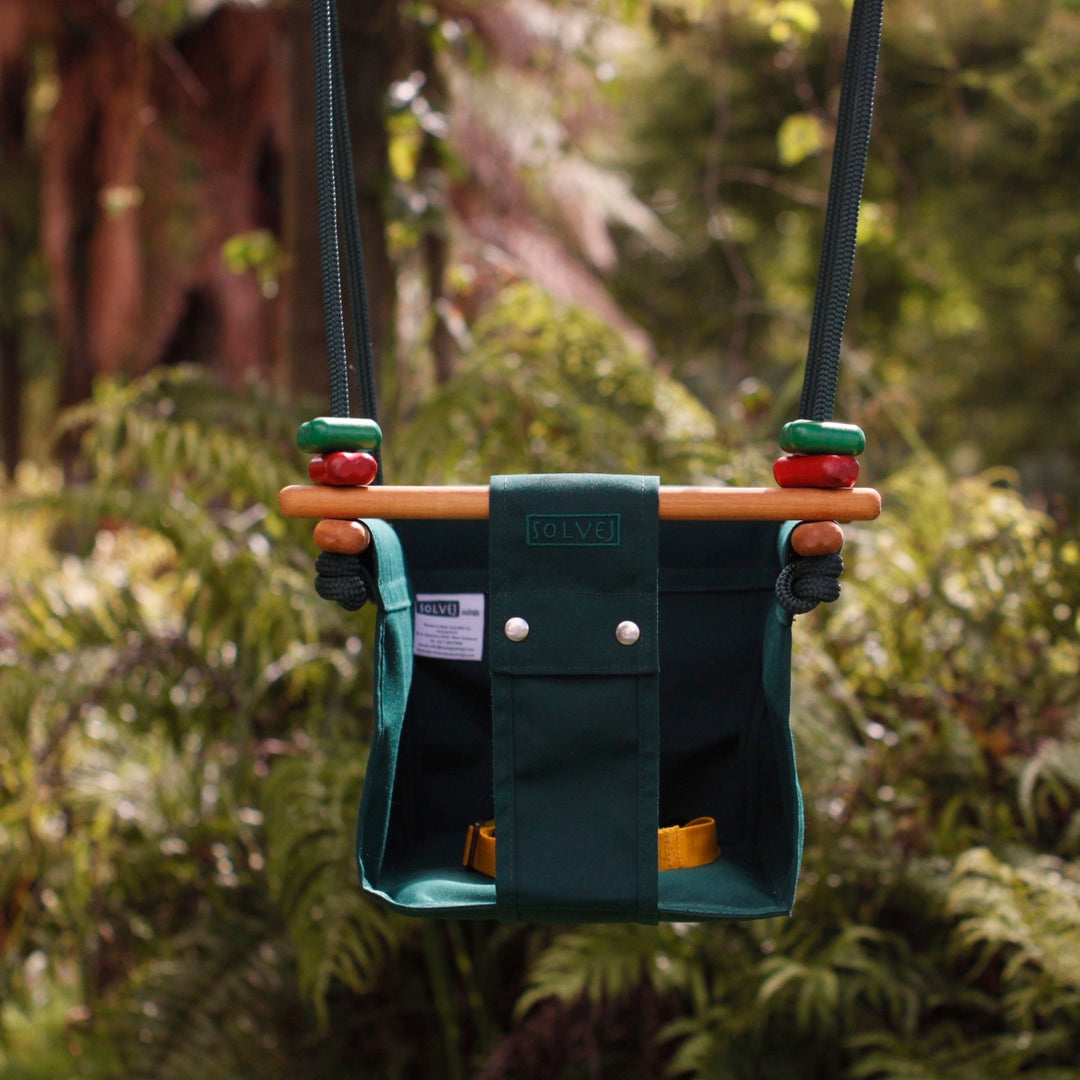 Forest Green SOLVEJ Convertible Baby & Toddler Swing from Australia hung outdoors