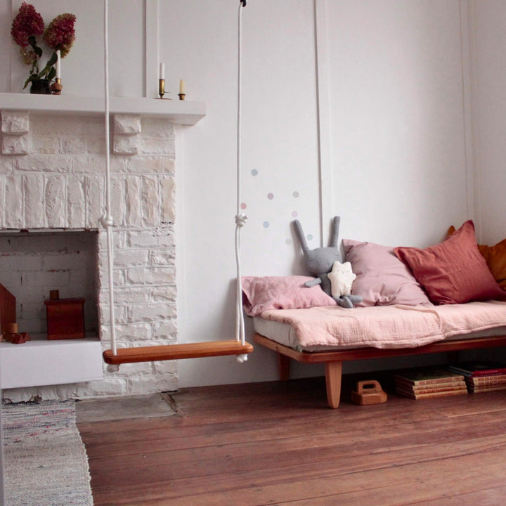 SOLVEJ Wooden Traditional Board Swing with White Rope from Australia hung indoors in child's bedroom