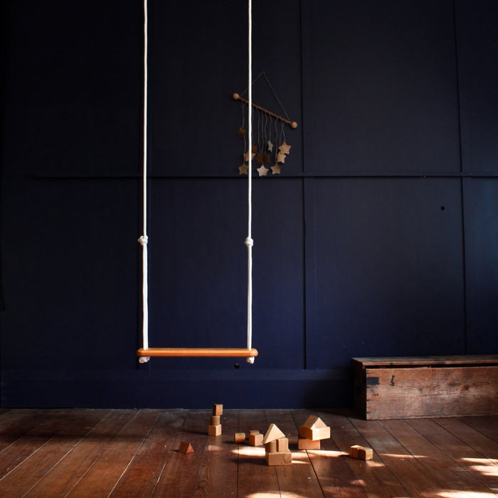SOLVEJ Wooden Traditional Board Swing with White Ropes from Australia hung indoors in child's play room
