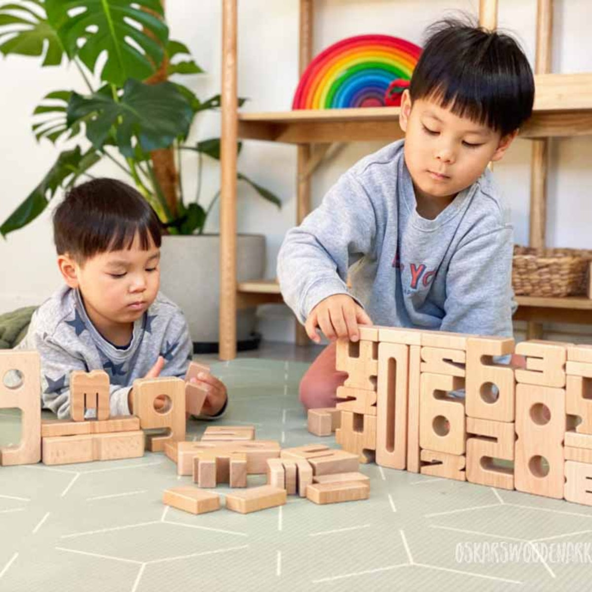 Two boys playing, stacking and learning with SumBlox Educational Number Block Set of 100 Pieces for Educational and Home Learning from Oskar's Wooden Ark in Australia